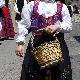 Wicker basket taken in procession by a girl wearing a typical costume