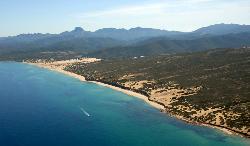 Aerial view of Piscinas and Mount Arcuentu on the backdrop
